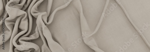 Elegant drapery of delicate beige fabric.