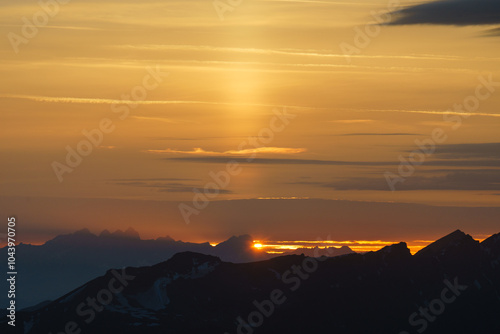 Sunrise at the summit of the mountain 