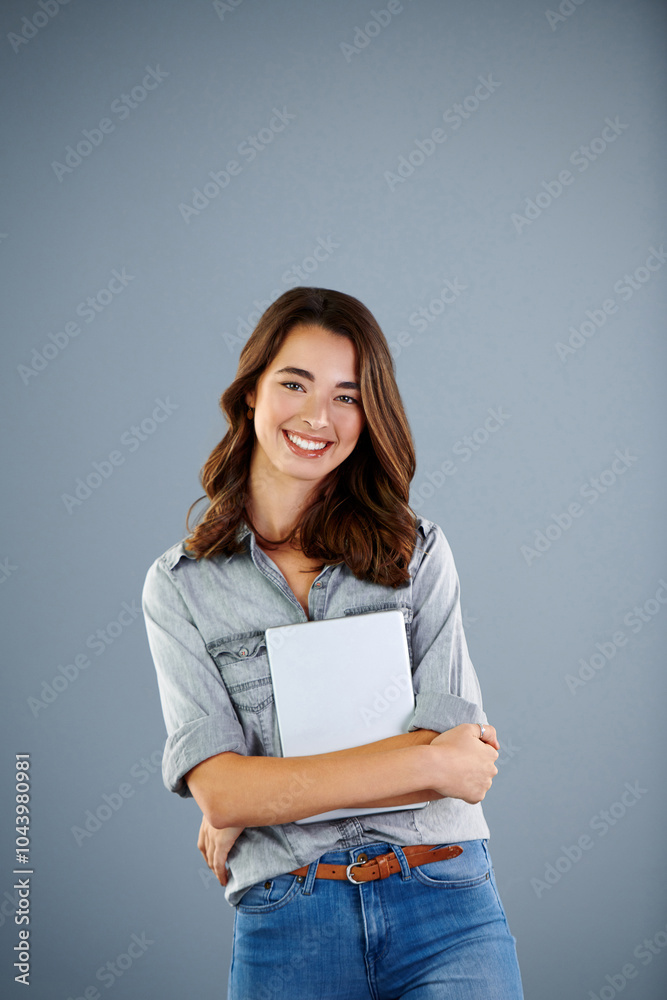 Fototapeta premium Student, tablet and portrait of girl in studio for research assignment, college thesis and online portal. Education, knowledge and elearning with person on gray background for university project