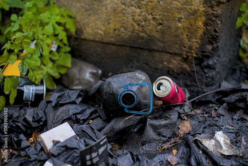 Plastic waste covered with used oil