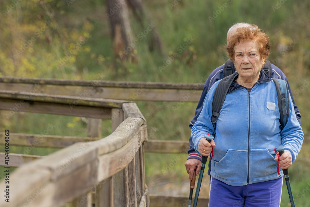Obraz premium senior couple hiking outdoors in nature