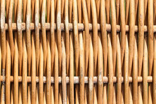 Wicker basket texture. Detailed view of woven pattern natural fibers. Rustic and traditional craftsmanship visible in the intricate design.