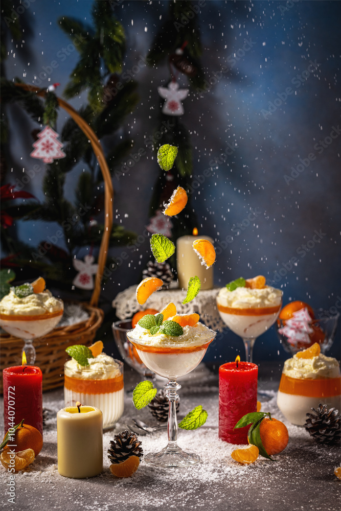 Christmas dessert panna cotta with tangerines and mint falling on it Christmas dessert panna cotta with tangerines and mint falling on it