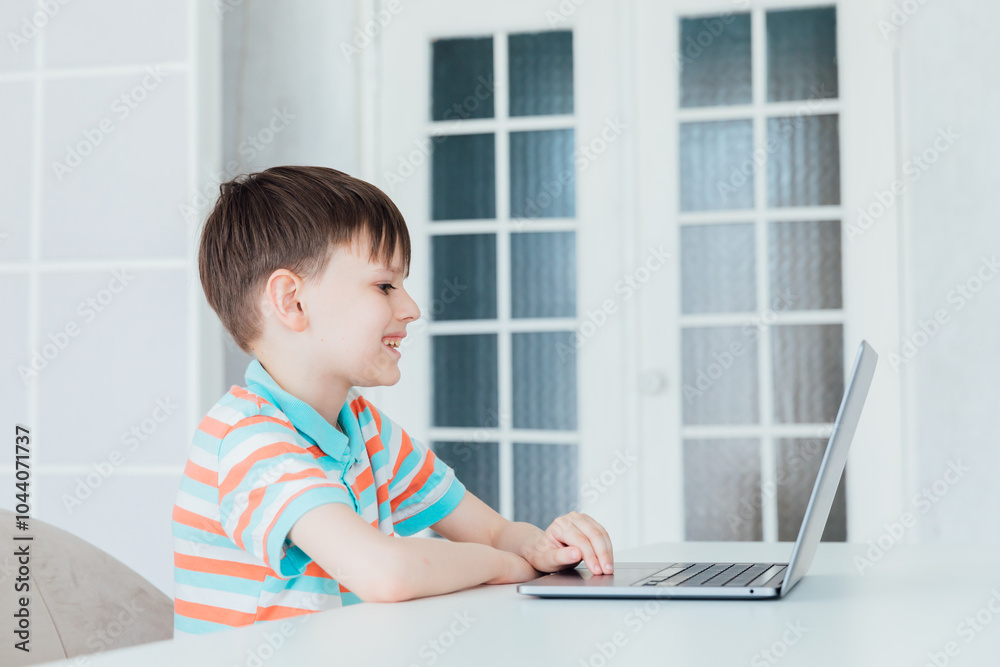 Schoolboy At Table With Laptop Online Schoolboy At Table With Laptop Online