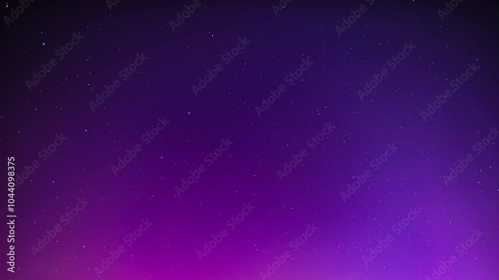 Night sky with aurora borealis as time lapse video. Abstract background of the stars and violet magenta colors due to polar light effects. The beautiful rays are moving through the frame.