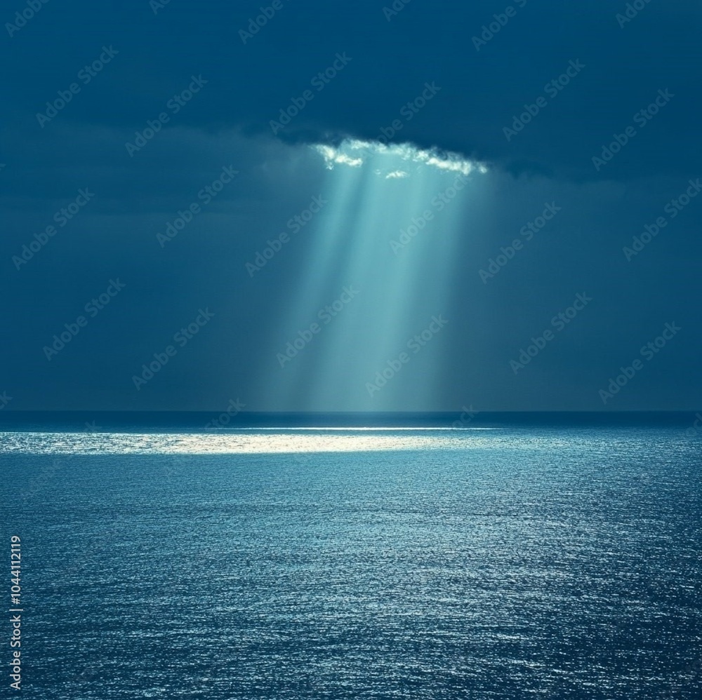 Amazing high resolution photos of the sea and sky of the same dark blue color and only on the horizon a ray of sun, breaking through the bad weather, illuminates the crystal-silver-blue sea. Nature Amazing high resolution photos of the sea and sky of the same dark blue color and only on the horizon a ray of sun, breaking through the bad weather, illuminates the crystal-silver-blue sea. Nature