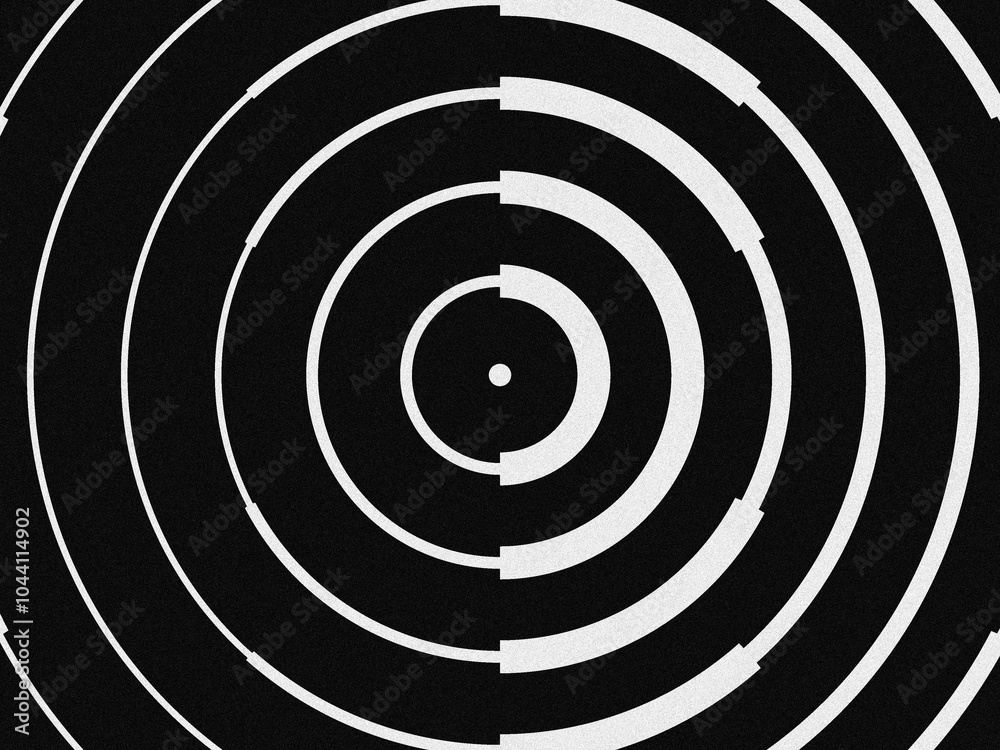 a black and white abstract design of concentric circles with a grainy texture. a black and white abstract design of concentric circles with a grainy texture.