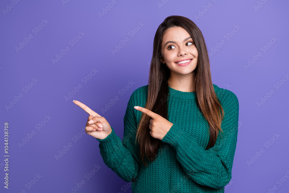 Portrait of nice young girl look point fingers empty space wear sweater isolated on violet color background Portrait of nice young girl look point fingers empty space wear sweater isolated on violet color background