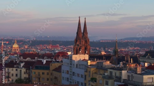 Wallpaper Mural Sunlight washes over the Prague skyline, casting long shadows from the Bazilika sv. Ludmily and other landmarks at sunset Torontodigital.ca