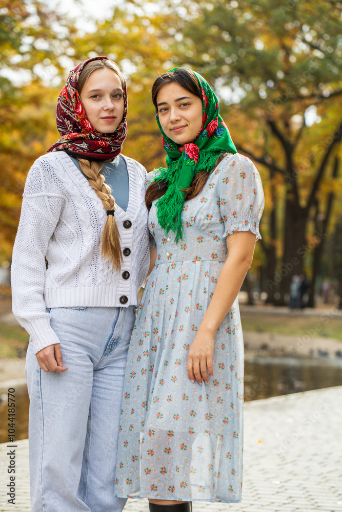 Fototapeta premium Russian beauty - young beautiful women in a traditional headscarf