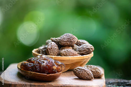 Malva nut or Scaphium macropodum Beaum dried fruits and jelly on natural background. photo