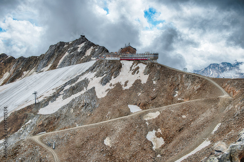 Restaurant perched on a mountain top in the Italian Alps photo