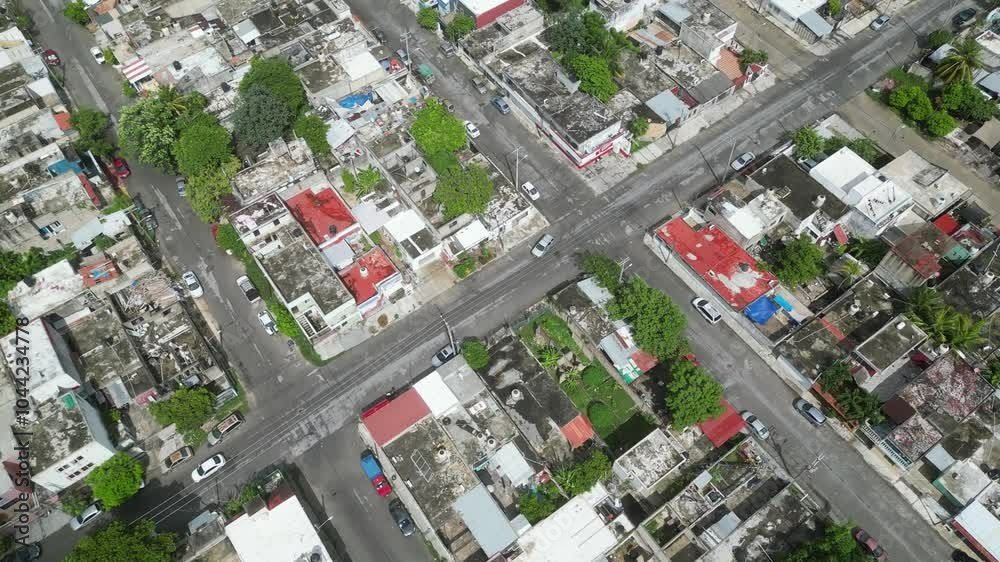 Aerial top-down view high altitude of slum, a heavily populated urban informal settlement characterised by substandard housing and squalor poor living conditions streets and rusty metal home roof tops Aerial top-down view high altitude of slum, a heavily populated urban informal settlement characterised by substandard housing and squalor poor living conditions streets and rusty metal home roof tops