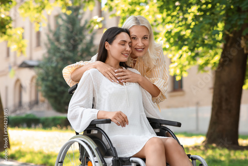 Young woman in wheelchair a...