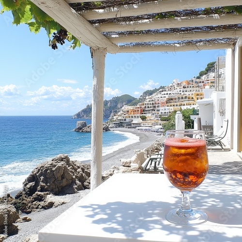 Seaside Escape in Positano Italy with Stunning Ocean Views and Refreshing Aperol Spritz on Sunlit Terrace Overlooking Picturesque Amalfi Coastline