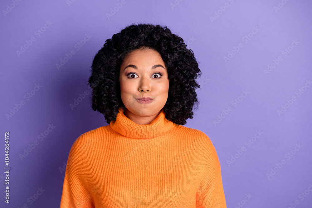 Photo of crazy funny cheerful lovely woman wear knitted stylish jumper bloated cheeks isolated on purple color background Photo of crazy funny cheerful lovely woman wear knitted stylish jumper bloated cheeks isolated on purple color background