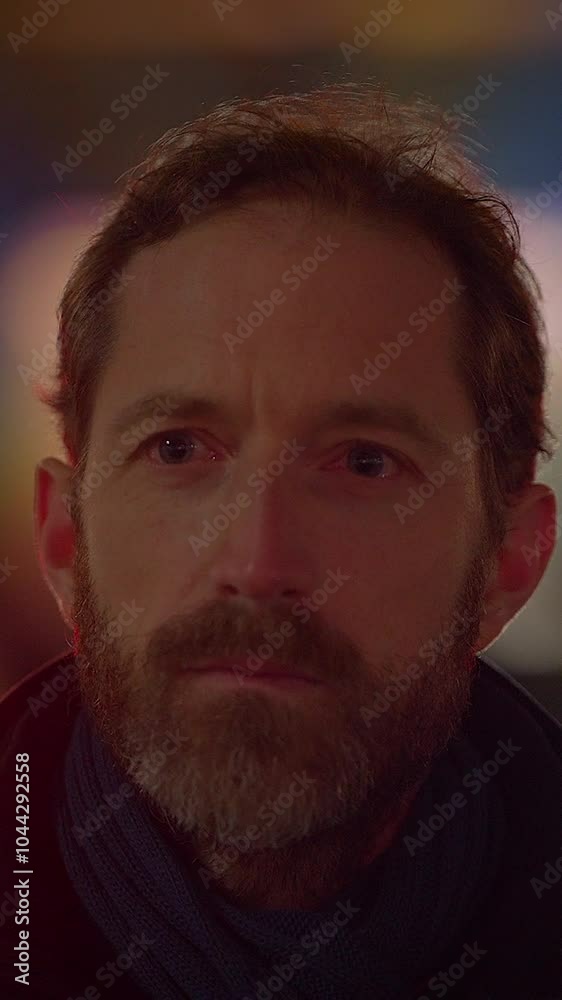 A Pensive Man Appears in a Dimly Lit Background, Evoking Contemplation and Depth