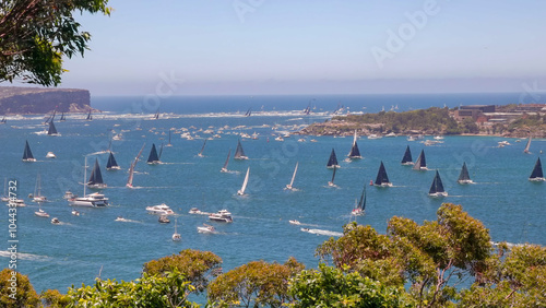 boats sail towards north head at the start of the sydney to hobart yacht race on sydney harbour, australia
