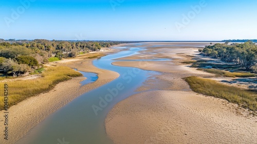 Serene River Landscape Under Blue Sky