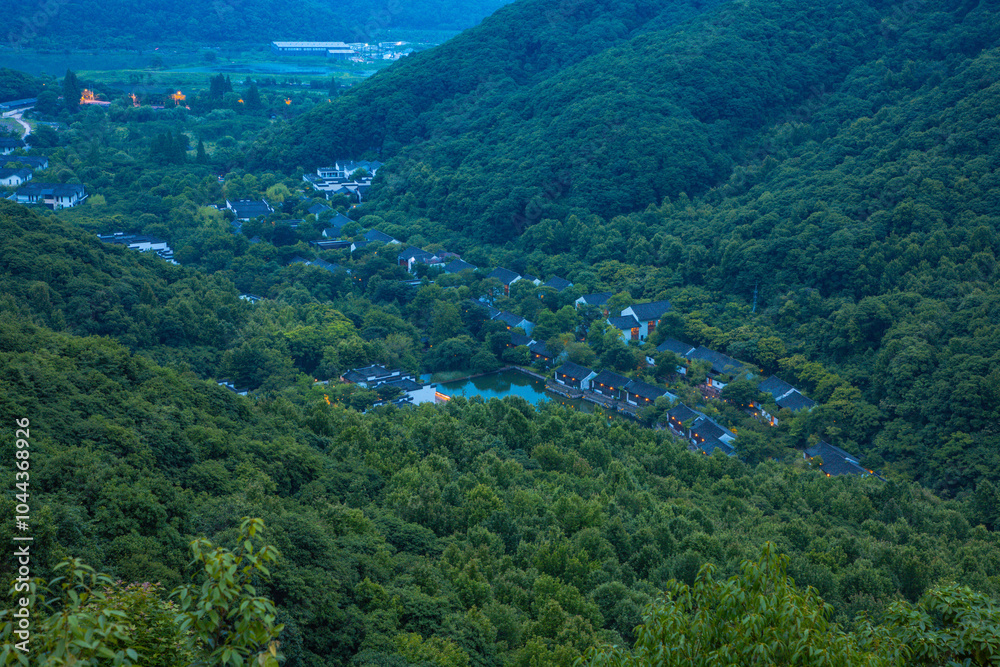 Fototapeta premium Shaoxing, Zhejiang Province - High angle view of trees and buildings at night