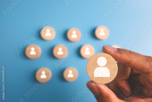 HR hiring recruit job.searching job and business leadership concept.hand holding wooden block with person icon.
