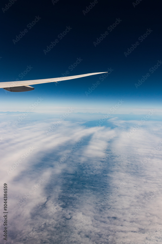 Obraz premium View from an airplane of the Kuril Islands and Sea of Okhotsk on a flight from Vancouver to Tokyo