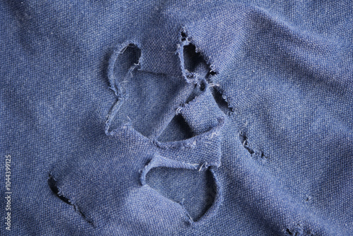  hole in the clothes. Close-up. photo