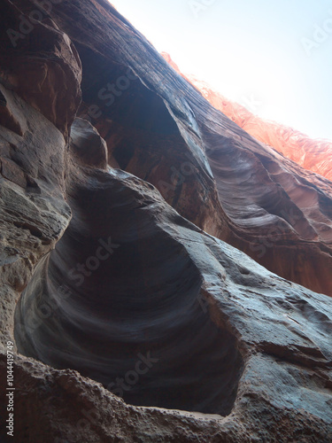 Natural cavity in sandstone eroded walls of Buckskin Gulch canyon photo