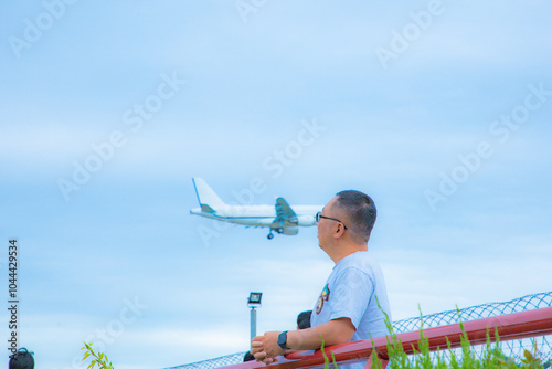 Shanghai Hongqiao Airport - Plane landing and people taking photos photo