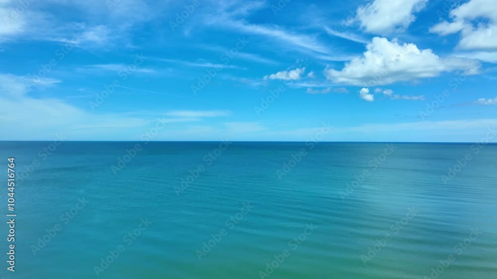 Nature of the beach and sea Summer with sunshine, sandy beaches, clear blue waters sparkling against the blue sky. On an island with good ecology and environment Background for summer vacation concept Nature of the beach and sea Summer with sunshine, sandy beaches, clear blue waters sparkling against the blue sky. On an island with good ecology and environment Background for summer vacation concept