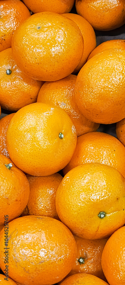 Many mandarines. Many ripe tangerines close-up. Bright background - tangerines. Benefits of citrus fruits. Many mandarines. Many ripe tangerines close-up. Bright background - tangerines. Benefits of citrus fruits.