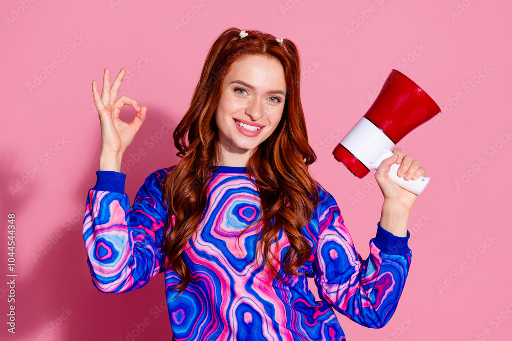 Photo of positive girl promoter hold loudspeaker make okay symbol isolated pastel color background Photo of positive girl promoter hold loudspeaker make okay symbol isolated pastel color background