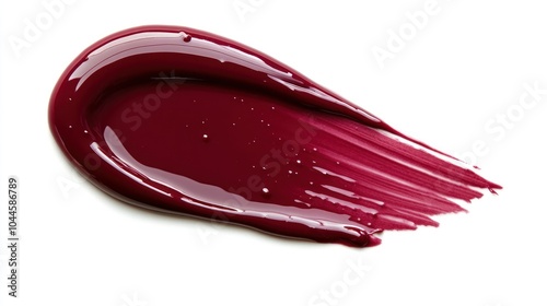 A glossy, deep burgundy paint smear, showcasing texture and color vibrancy.