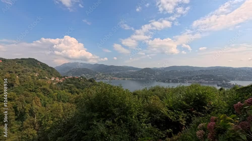 Timelapse of clouds passing fast in the sky over Orta Lake, Italy. Day to night lapse Timelapse of clouds passing fast in the sky over Orta Lake, Italy. Day to night lapse