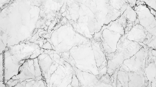 A marble texture background with natural veining in shades of white and gray, offering a sleek and sophisticated surface for luxury branding or interior design visuals