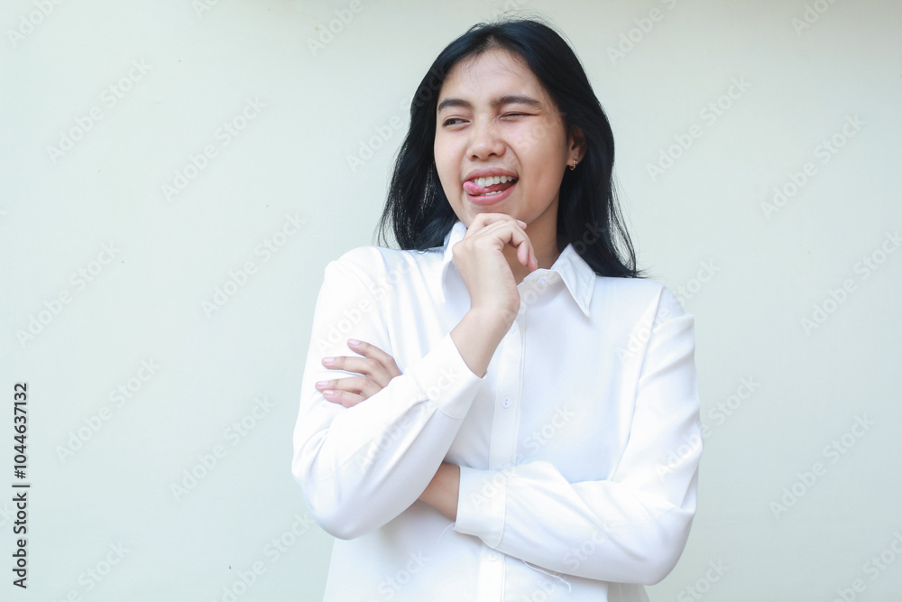 playful asian young business woman blink eye flirting aside thinking idea with hands on chin arms folded wearing white formal suit shirt, imagine plan with excitement, standing isolated background playful asian young business woman blink eye flirting aside thinking idea with hands on chin arms folded wearing white formal suit shirt, imagine plan with excitement, standing isolated background