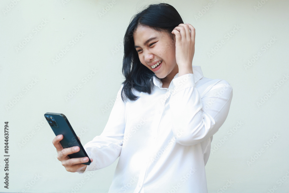 ecstatic cheerful beauty asian business woman laughing while using smartphone apps with raising finger through her dark hair wearing white shirt formal suit, read funny articles, standing isolated ecstatic cheerful beauty asian business woman laughing while using smartphone apps with raising finger through her dark hair wearing white shirt formal suit, read funny articles, standing isolated