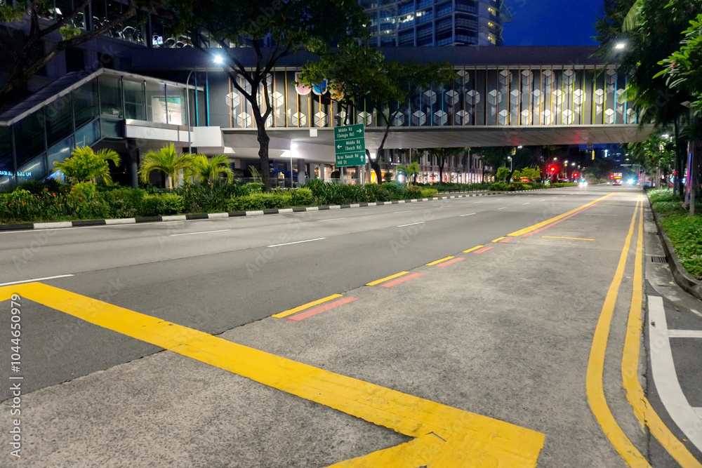 Asphalt Road and City Street With Modern Building at Night Asphalt Road and City Street With Modern Building at Night