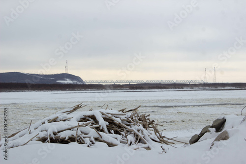 Winter landscape with frozen river, ice and snow-covered trees. winter landscape