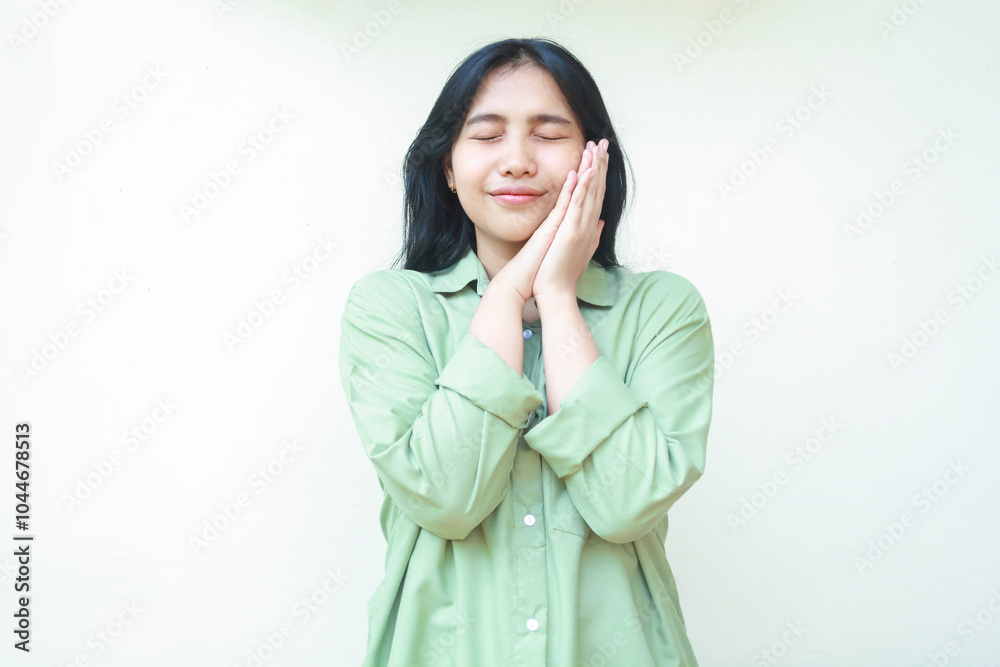 happy beautiful asian woman wearing green over size casual shirt enjoy sleep time isolated on white background happy beautiful asian woman wearing green over size casual shirt enjoy sleep time isolated on white background