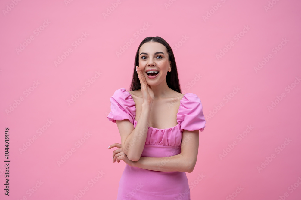 Excited young cute dark-haired young woman on a pink background Excited young cute dark-haired young woman on a pink background