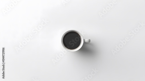 90. A top-down view of a plain white cup placed on a clean surface, creating a minimalist effect