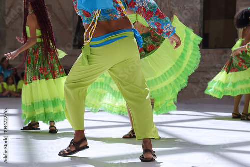 Dancers dancing and wearing one of the traditional folk costume from Brazil photo