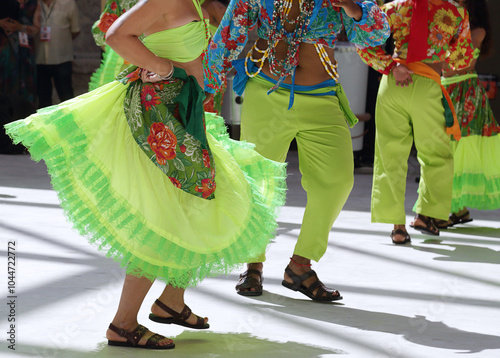 Dancers dancing and wearing one of the traditional folk costume from Brazil photo