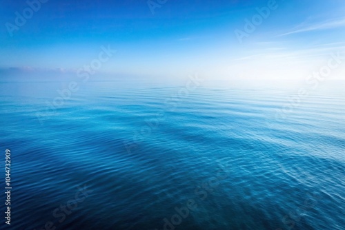 Tranquil blue sea with foggy background