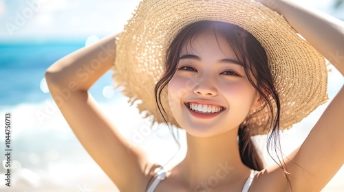 Happy young Asian woman wearing straw hat on beautiful beach. Summer vacation on tropical beach