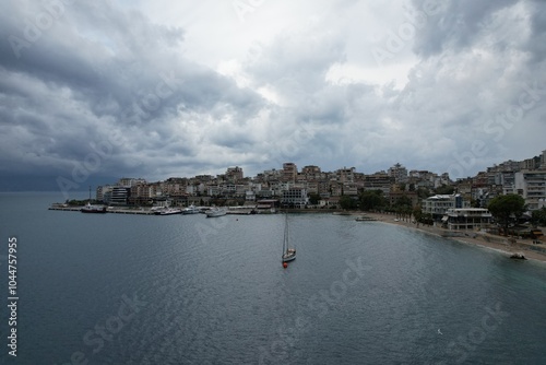 Sarande town Albania,Ionian Sea coast is renowned for its stunning landscapes and vibrant atmosphere.Aerial panorama views of the city reveal a picturesque blend of turquoise waters, sandy beaches