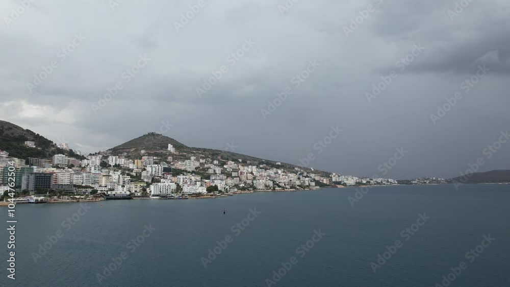 Sarande town Albania,Ionian Sea coast is renowned for its stunning landscapes and vibrant atmosphere.Aerial panorama views of the city reveal a picturesque blend of turquoise waters, sandy beaches Sarande town Albania,Ionian Sea coast is renowned for its stunning landscapes and vibrant atmosphere.Aerial panorama views of the city reveal a picturesque blend of turquoise waters, sandy beaches