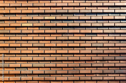 background, texture of red brown brick wall. Facing bricks on facade of modern building.