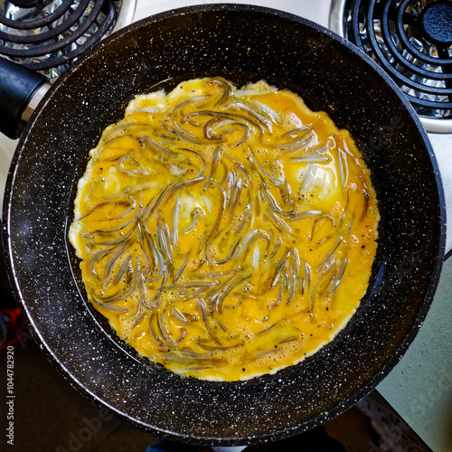 Canvas-taulu A whitebait pattie being cooked ready to make a whitebait sandwich